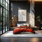 Modern bedroom with a bed, framed art print of a monochrome flower, and large windows.