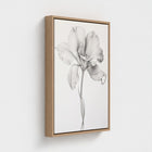 Framed Art Print of a black and white flower on a light gray background
