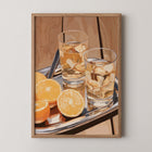 Still life wall art print titled Amber Evening showing glasses and sliced citrus in warm amber tones with soft lighting.