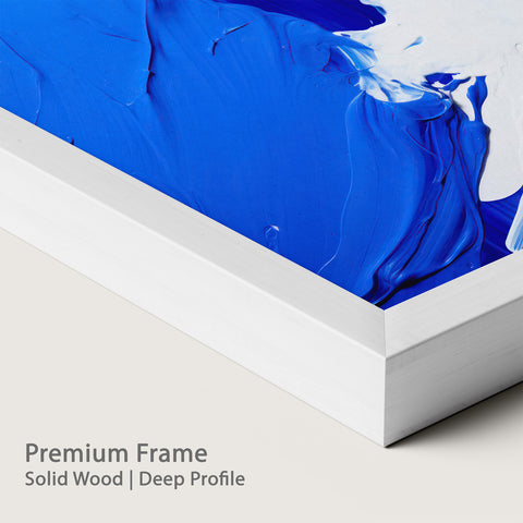 Blue abstract painting with a chalk wood frame on a plain background