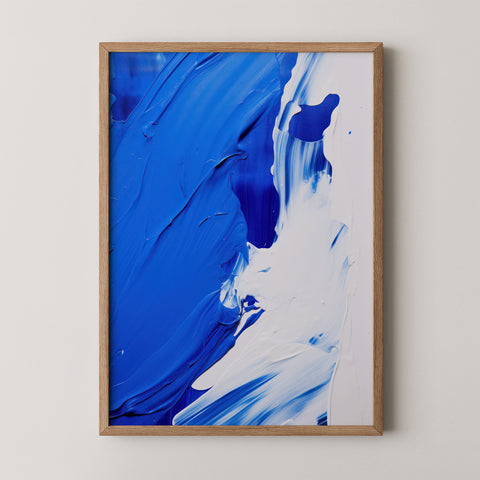 Abstract art print with blue brushstrokes in a frame.