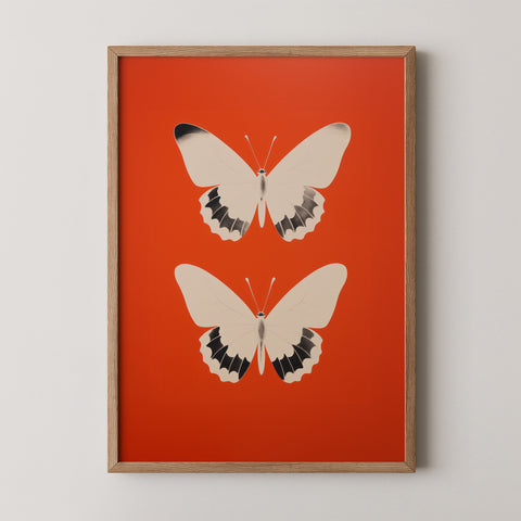 Framed art print with two butterflies on a red background