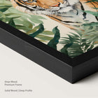 Framed artwork of a tiger among leaves with an onyx wood frame.