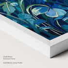 Artwork with blue and green floral design in a chalk wood frame.