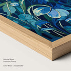 Artwork with blue and green floral design in a natural wood frame.