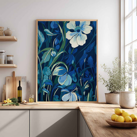 Framed floral art print in a kitchen setting with a window and shelves.