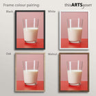 Artwork of a glass of milk on a pink and red background placed in black, white, oak and walnut frames.