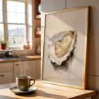 Framed art print of an oyster on a kitchen counter with a steaming cup of coffee.