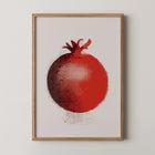 Framed art print of a red pomegranate on a beige background