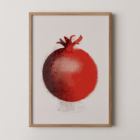 Framed art print of a red pomegranate on a beige background