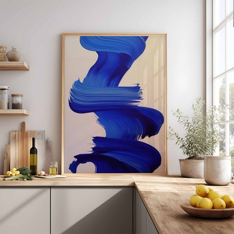 Abstract blue art print on a wall in a modern kitchen