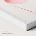 Chalk wood framed pink abstract artwork.