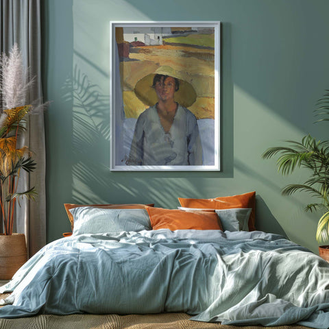 Framed art print painting above a bed with colourful pillows in a bedroom setting.