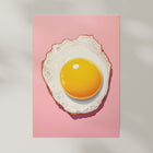 Art print of a fried egg on a pink background