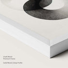 Chalk wood frame with monochrome abstract artwork.