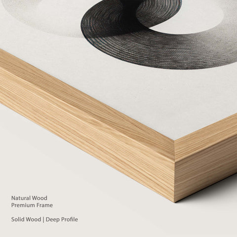 Natural wood frame with monochrome abstract artwork.