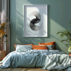 Modern bedroom with pillows, and a large window. Large monochrome abstract art print on wall.